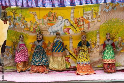 Picture of puppets arranged in series in Jaipur, Rajasthan. tradition, culture love stories history mythology colorful pretty rajput magic belief art artist obsolete economy poor fort fair village