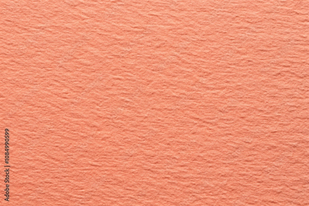 Rough grain paper texture with pastel coral background Rough grain paper texture with pastel coral background