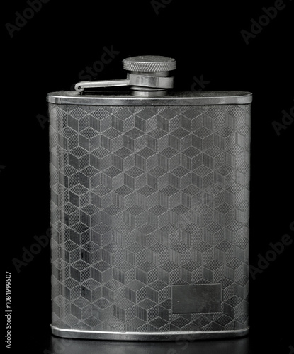 metal flask on a black background photo