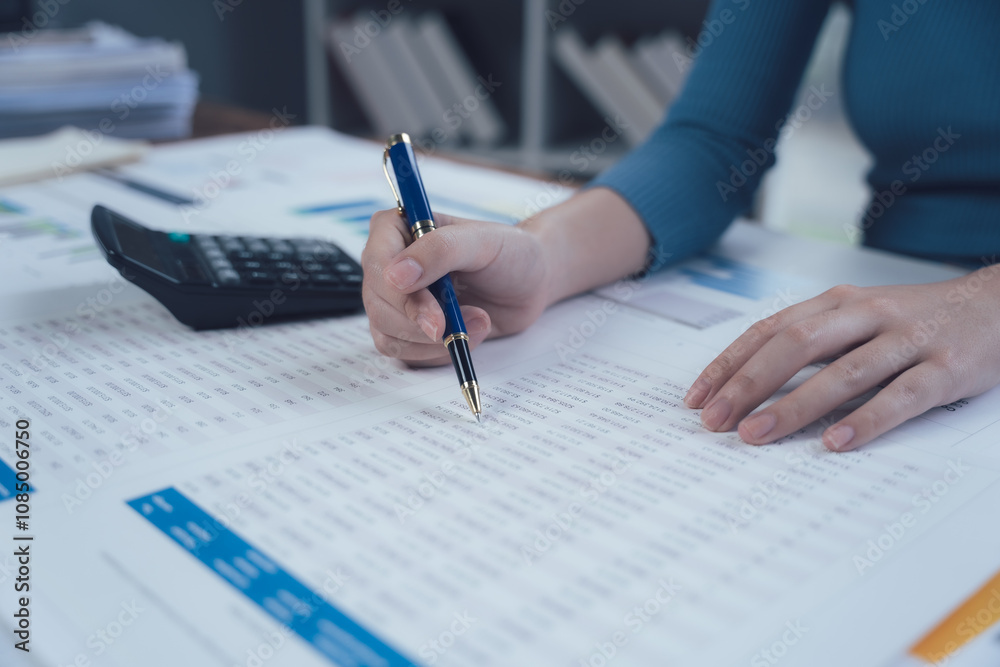 Focused on Success: A close-up view of a woman's hand meticulously filling out paperwork, a pen held firmly in her grip. The image captures the dedication and precision required for business success. Focused on Success: A close-up view of a woman's hand meticulously filling out paperwork, a pen held firmly in her grip. The image captures the dedication and precision required for business success.