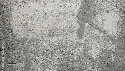 Close-up of a rough, textured concrete wall with a gray tone. The surface shows subtle details, cracks, and imperfections, ideal for backgrounds, industrial themes, or design projects requiring a raw 