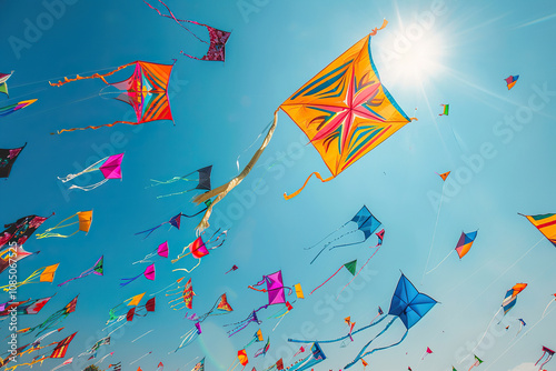 Beautiful greeting card with colorful kites soaring high above vibrant sky to holiday composition photo