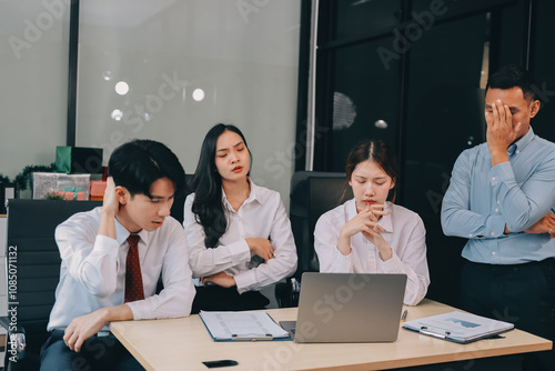 Frustrated upset multiracial business team people sad with bad work result in report disappointed in corporate bankruptcy failure crisis worried of paperwork problem sit at table at office meeting