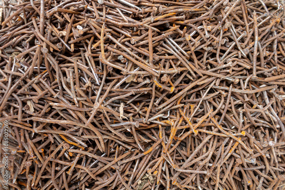 Pile of Rusty Nails from Construction on Concrete Surface Pile of Rusty Nails from Construction on Concrete Surface