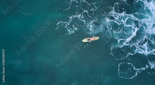 Aerial view of the ocean and surfer girl. Surfing in Midigama. Sri Lanka