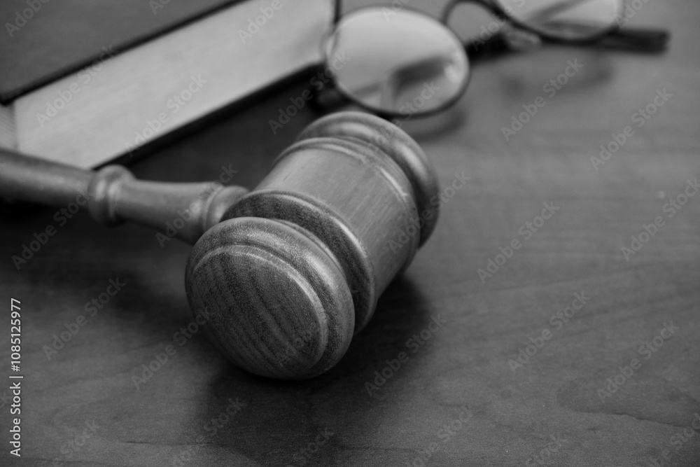 Wooden gavel, legal book and eyeglasses. Law and court concept. Copy space for text. Wooden gavel, legal book and eyeglasses. Law and court concept. Copy space for text.