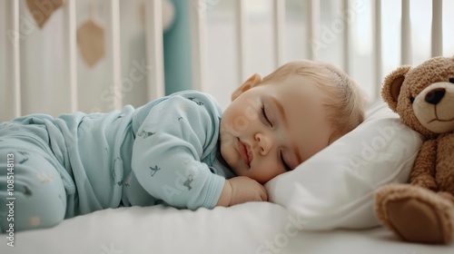 Wallpaper Mural Close-up of a serene sleeping baby in pastel blue pajamas, gentle lighting, cozy crib with white sheets and a teddy bear companion Torontodigital.ca