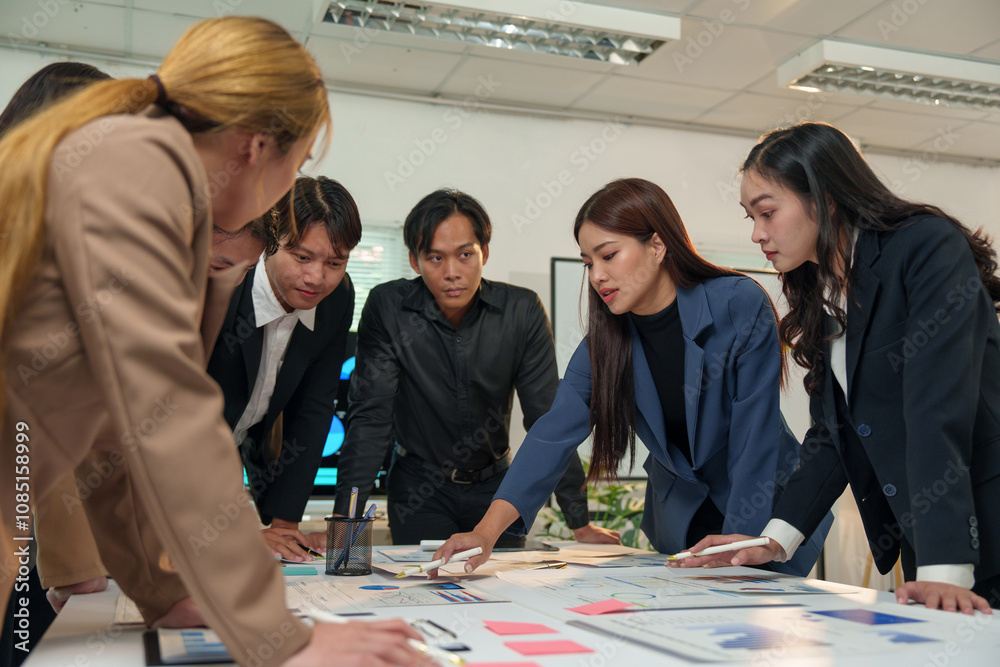 © crizzystudio - Financial analyst analyzes business finance reports on laptop and graph documents during corporate meeting discussions showing successful teamwork, business meeting ideas, marketing. © crizzystudio - Financial analyst analyzes business finance reports on laptop and graph documents during corporate meeting discussions showing successful teamwork, business meeting ideas, marketing.