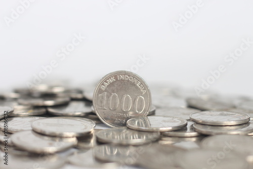 Indonesian 1000 rupiah coins on white background.