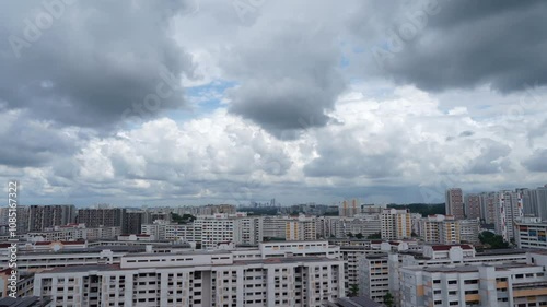 Time lapse video of urban building with white and rain clouds