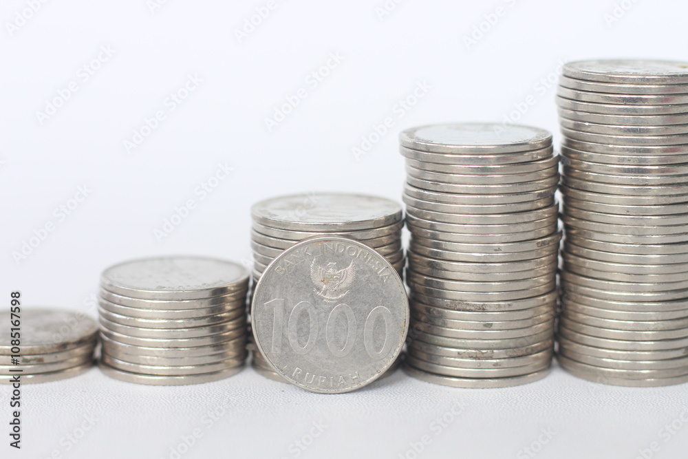 Statistical graphic model of a stack of IDR 1000 rupiah coins These coins bears the image of the Indonesia state symbol Garuda Pancasila, and the words Statistical graphic model of a stack of IDR 1000 rupiah coins These coins bears the image of the Indonesia state symbol Garuda Pancasila, and the words