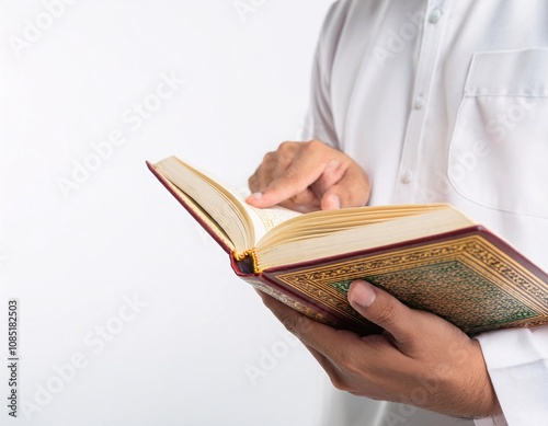 a Muslim holding the Koran, reflects religious values, tranquility, and spiritual connection photo