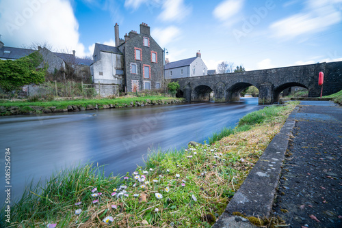 The Charming and beautiful town of Bushhmills with the river and bridge, Northern Island, Uk. photo