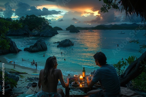 Couple enjoying a romantic dinner by the beach at sunset with a beautiful view of the ocean and distant islands photo