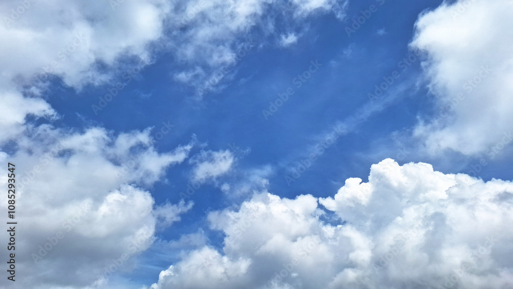 The beauty of a bright blue sky with white clouds that have a soothing effect. This beautiful color combination with blue sky background.