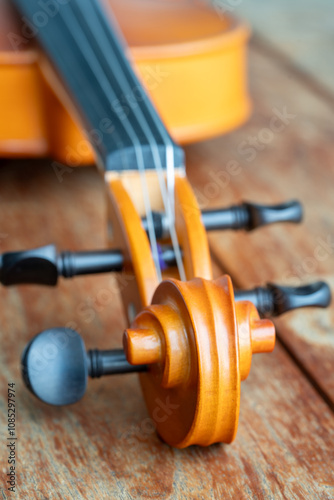 Music instrumnet viloin macro in a wooden table photo