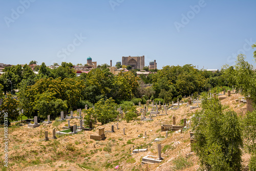 View of Bibi-Khanym Mausoleum in the background and in the foreground an earthen cemetery photo