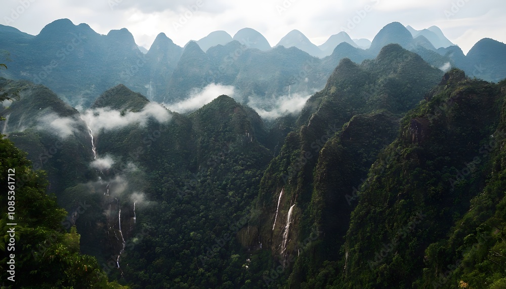 Obraz premium Mist-Covered Peaks of the Phou Khao Khouay Mountains