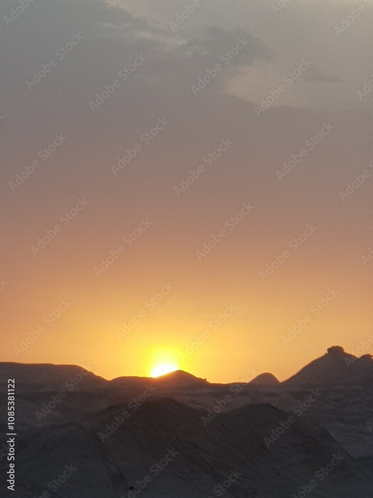 A desert landscape with rugged rock formations and clear blue sky, showcasing the harsh yet stunning beauty of arid regions. A desert landscape with rugged rock formations and clear blue sky, showcasing the harsh yet stunning beauty of arid regions.