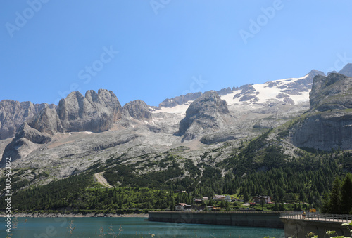 Marmolada mountain with the glacier in Italy and the waters of the artificial lake called LAGO FEDAIA photo