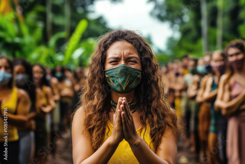 Activists forming a human chain around a deforested area, protesting industrial logging, emotional expressions on their faces. photo