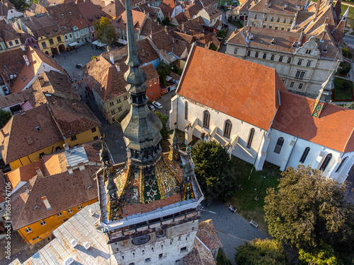 Aerial drone view of sighisoara clock tower at sunset photo