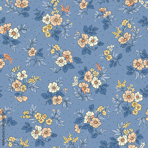 Floral pattern. Liberty flowers on light blue background. Printing with small white, yellow and orange flowers. Ditsy print. Seamless vector texture. Spring bouquet.