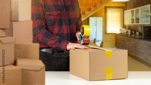 Man packs things for moving...