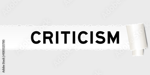 Ripped gray paper background that have word criticism under torn part