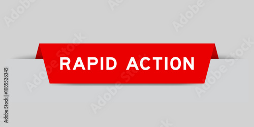 Red color inserted label with word rapid action on gray background