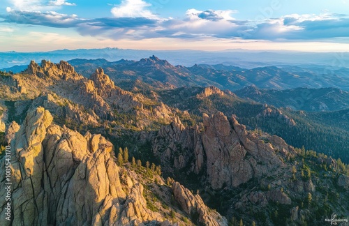 striking photo of the jagged peaks at sunset, taken from an aerial perspective in the high mountains