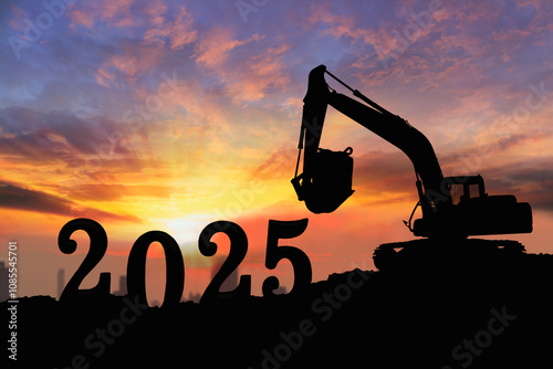 Concept happy new year 2025,crawler excavator silhouette with lift up bucket .On sunrise backgrounds