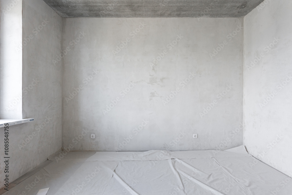 interior of the apartment without decoration in gray colors. rough finish interior of the apartment without decoration in gray colors. rough finish