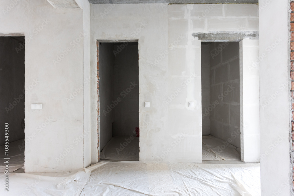 interior of the apartment without decoration in gray colors. rough finish interior of the apartment without decoration in gray colors. rough finish