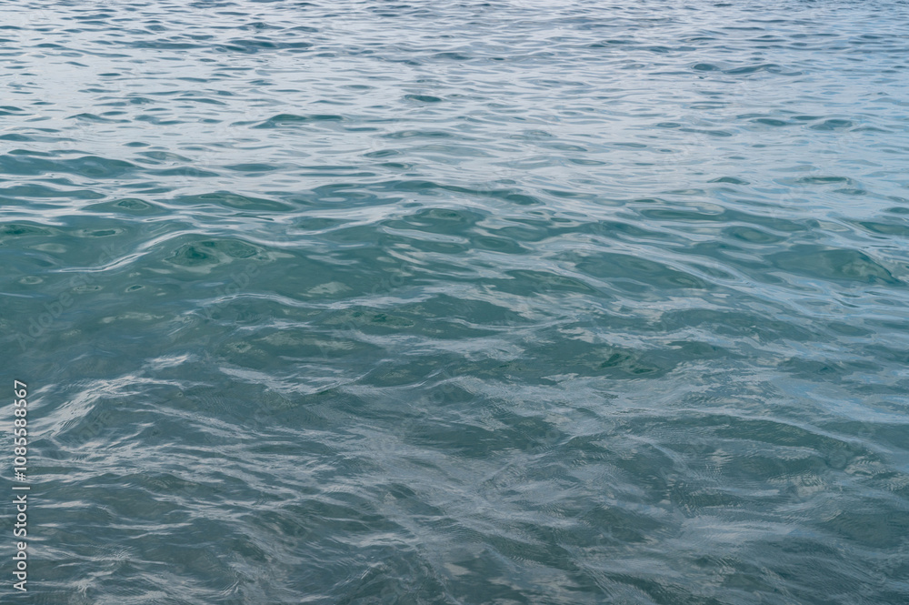 Sea surface with waves. Abstract background of water flow in ocean, sea, river, lake. Seascape wallpaper. Sea surface with waves. Abstract background of water flow in ocean, sea, river, lake. Seascape wallpaper.