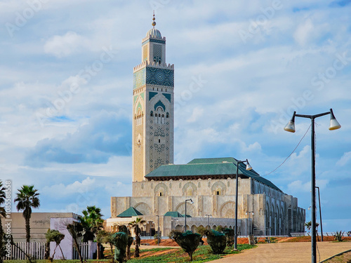 view of Hassan II Mosque against blue sky - The Hassan II Mosque or Grande Mosquée Hassan II is a mosque in Casablanca, Morocco.