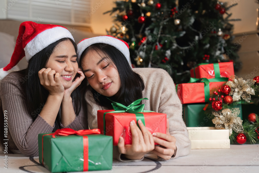 Joyful Young Couple Celebrating Christmas with Surprise Gifts by the Tree in a Cozy Holiday Setting Joyful Young Couple Celebrating Christmas with Surprise Gifts by the Tree in a Cozy Holiday Setting