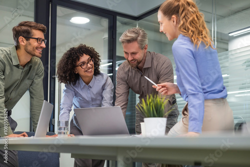 Business team discussing together business plans in office.