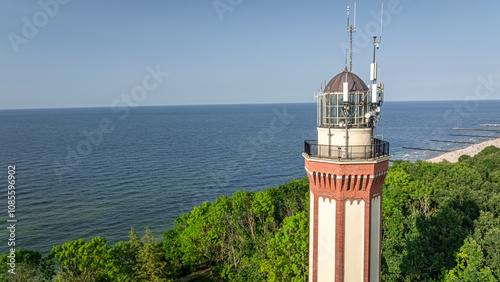 Lighthouse by Baltic sea in Rewal at summer, Poland. photo