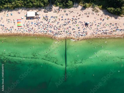 Crowded beach in summer on Baltic Sea. photo