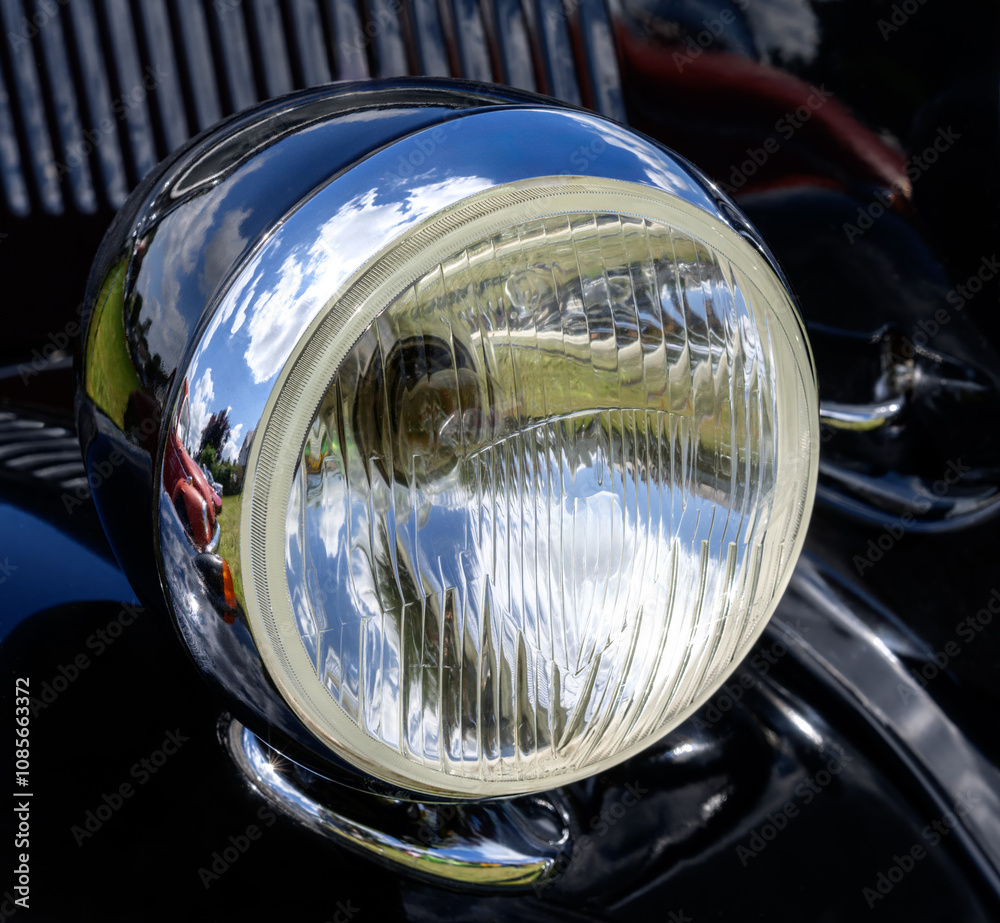 Old-Timer Headlight of a black vintage car