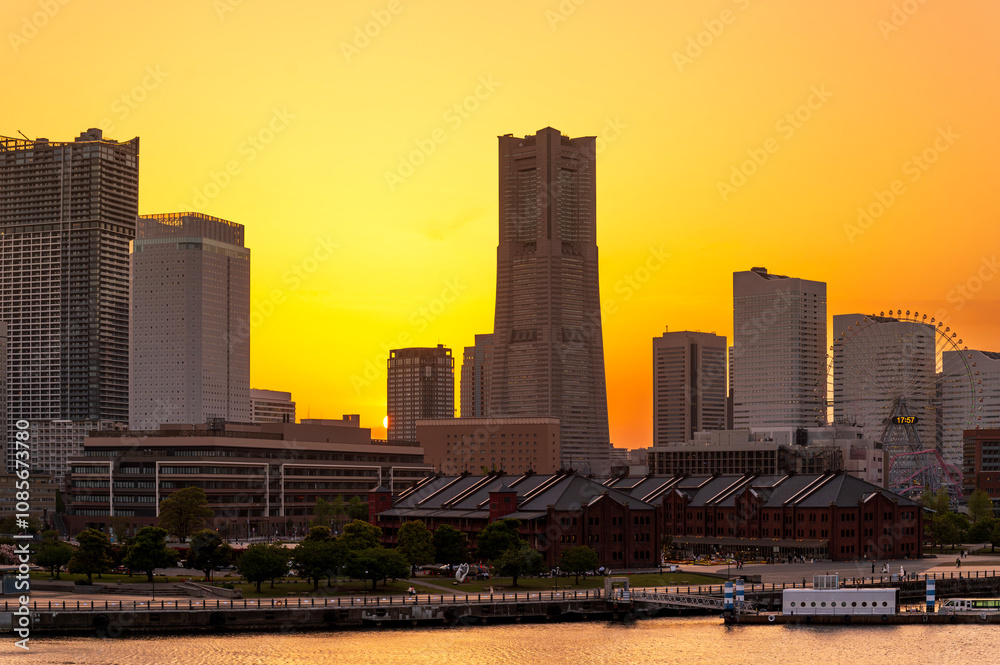 sweet gold sunset winter and light illumination from Cityscape of Yokohama city, Skyline and office building and downtown in Minatomirai Area, Yokohama city port, Kanagawa, Japan