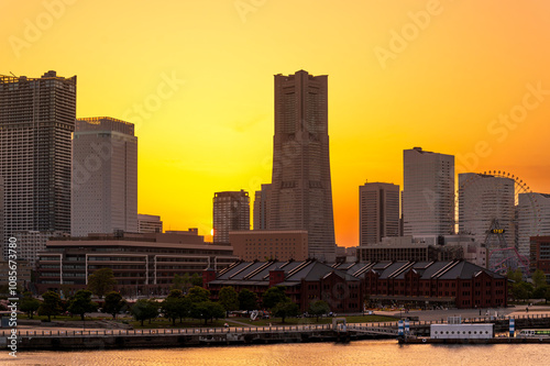Obraz na płótnie sweet gold sunset winter and light illumination from Cityscape of Yokohama city, Skyline and office building and downtown in Minatomirai Area, Yokohama city port, Kanagawa, Japan w salonie