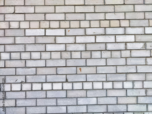 Wallpaper Mural Gray brick wall with varying textures and patterns in natural light Torontodigital.ca