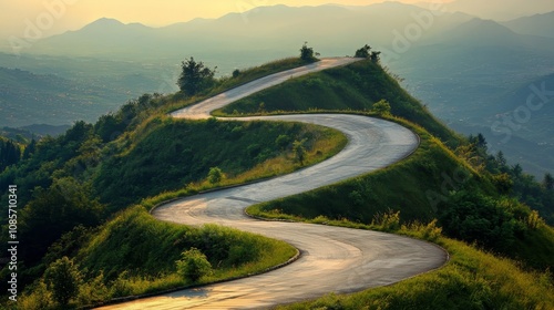 Scenic winding road leading up to the majestic peak of a stunning mountain landscape