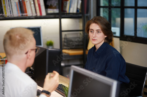 businesswoman meeting and talking about work or project with colleague in the office