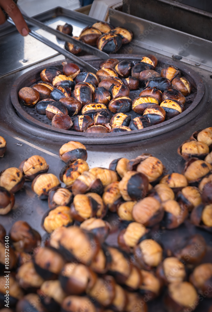 Fried chestnut vendor. street food. Fried chestnut vendor. street food.