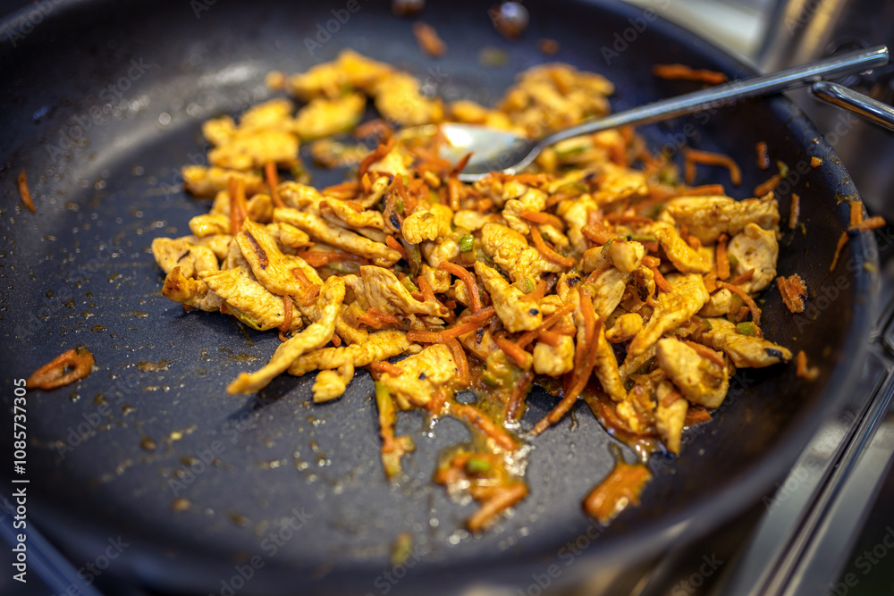 Chef frying cut vegetables and chicken in pan in restaurant kitchen. Chef frying cut vegetables and chicken in pan in restaurant kitchen.