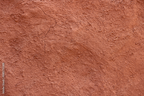 Square Brown texture of wall of rural Indian house made from clay mixed with cow dung.