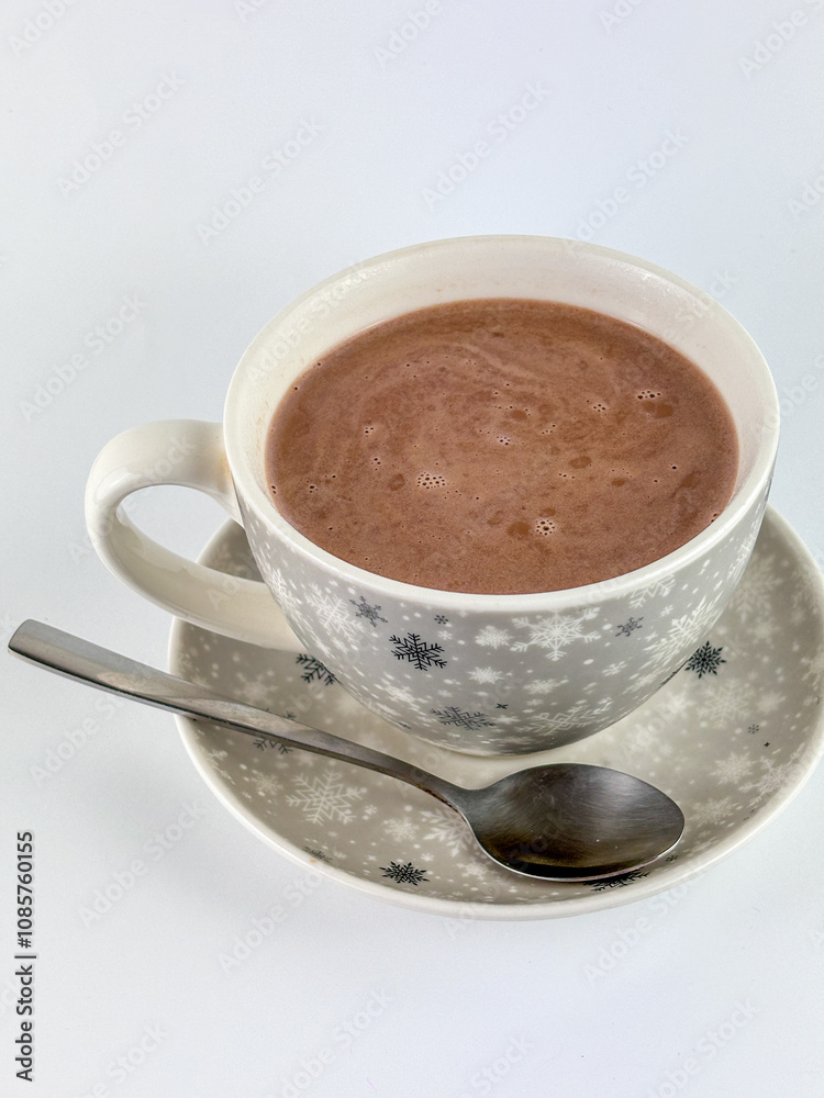 cup of hot chocolate with milk and a spoon on a white isolated background cup of hot chocolate with milk and a spoon on a white isolated background